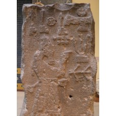 Ada-Nirari III praying in front of god symbols, solar disc